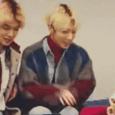 Two People Sitting On A Couch Blurry GIF