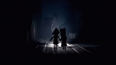 Two People Standing In Dark Room GIF