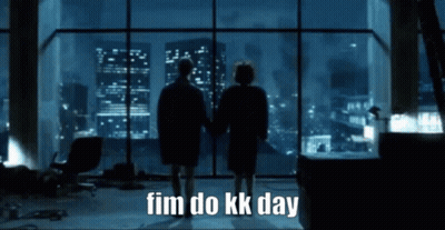 Two People Standing In Front Of A Large Window With The Words " Fim Do Kk Day " On The Bottom GIF