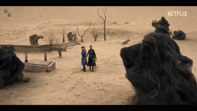 Two People Standing In The Desert With Netflix Written On The Bottom GIF