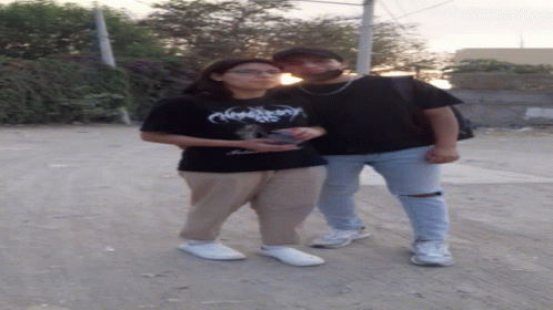 Two People Standing Next To Each Other GIF