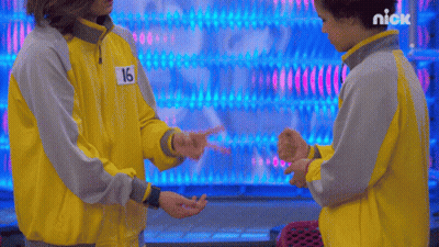 Two People Standing Together One In Yellow Jacket Number 16 GIF