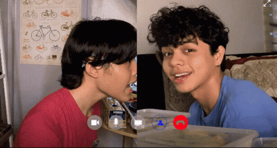 Two People Video Call One Wearing Blue Crews Shirt GIF