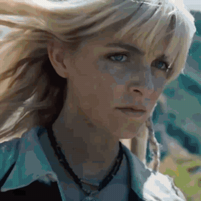 Two People Walking In Grassy Field With Number 03 GIF