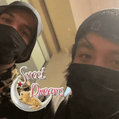 Two People Wearing Face Masks GIF
