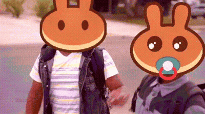Two People with Pancakes on Faces and Pacifiers