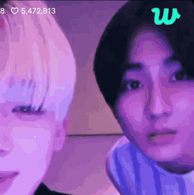 Two People With Purple Background And Green Letter W GIF