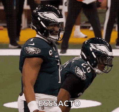 Two Philadelphia Eagles Players Side By Side GIF