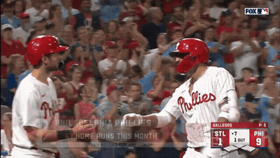 Two Phillies Players Shake Hands During A Game GIF