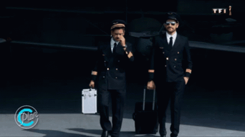 Two Pilots Walking In Front Of An Airplane With A Tfi Logo GIF