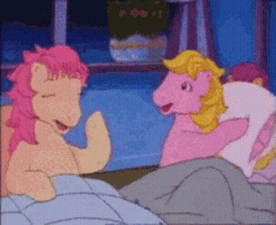 Two Pink Ponies Are Talking To Each Other In A Bedroom GIF