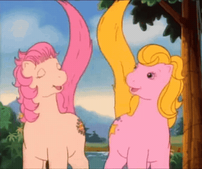 Two Pink Ponies Standing Together GIF