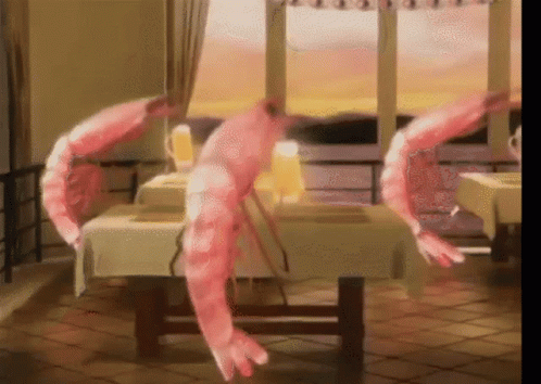 Two Pink Shrimp Sitting On Table GIF