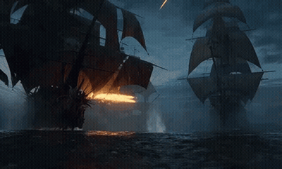 Two Pirate Ships Fighting At Night GIF