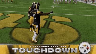 Two Pittsburgh Steelers Players Standing On Field GIF
