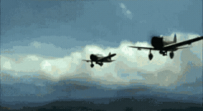 Two Planes Flying In Cloudy Sky GIF