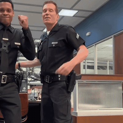 Two Police Officers One With Smith Name Tag GIF