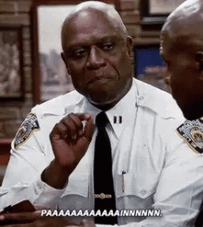 Two Police Officers Sitting At Table GIF