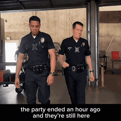 Two Police Officers Walking In Garage Saying The Party Ended An Hour Ago And They're Still Here GIF