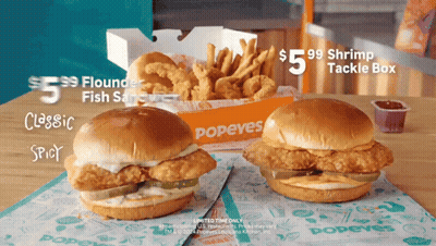 Two Popeye 'S Chicken Sandwiches On A Table GIF