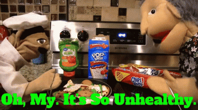 Two Puppets Are Cooking In Front Of A Stove With The Words " Oh My It 'S So Unhealthy " On The Bottom GIF