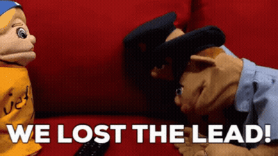 Two Puppets On Red Couch We Lost The Lead GIF