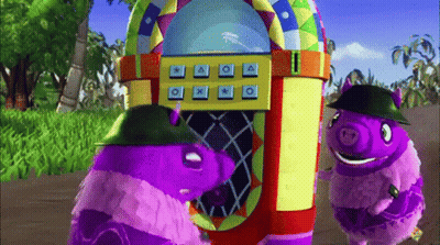 Two Purple Pigs Are Standing In Front Of A Jukebox With Buttons For A X And O GIF