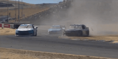 Two Race Cars Are Going Down A Track And One Has The Number 1 On The Front Of It GIF