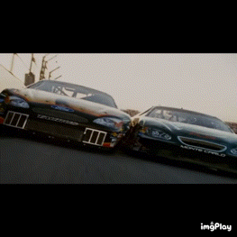 Two Race Cars Are Racing On A Track With A Watermark That Says Imgplay At The Bottom GIF