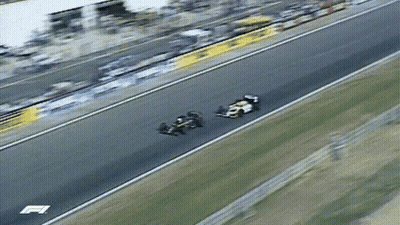 Two Race Cars On Track With Letter F GIF