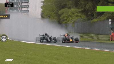 Two Race Cars On Track With Number 100 GIF