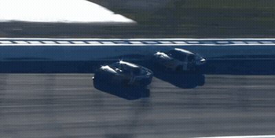 Two Race Cars Racing Number 14 GIF