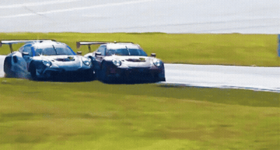 Two Race Cars Racing One With Yellow Sticker GIF