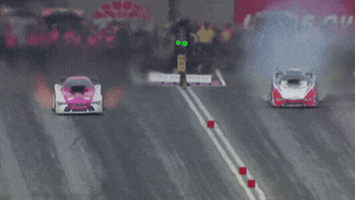 Two Racing Cars, One With Number 11 GIF