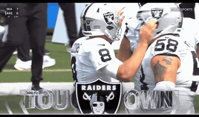 Two Raiders Football Players On Field GIF