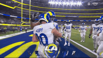 Two Rams Players Hugging Each Other On The Field GIF