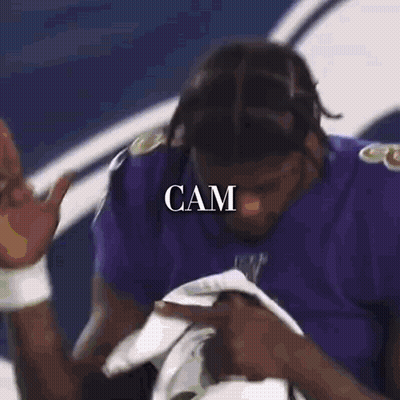 Two Ravens Football Players Hugging GIF