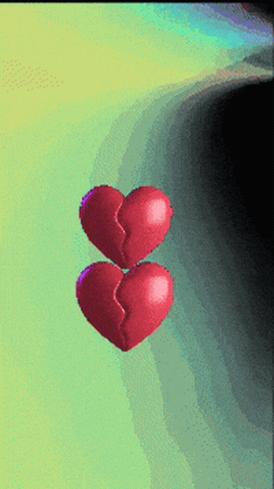 Two Red Hearts Floating On Green GIF