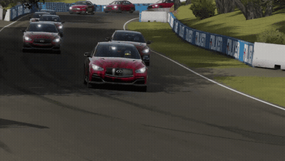 Two Red Infiniti Cars Are Driving On A Track GIF