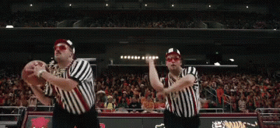Two Referees Holding Basketball On Court GIF