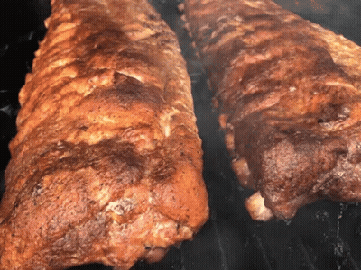 Two Ribs Cooking On Grill With Smoke GIF