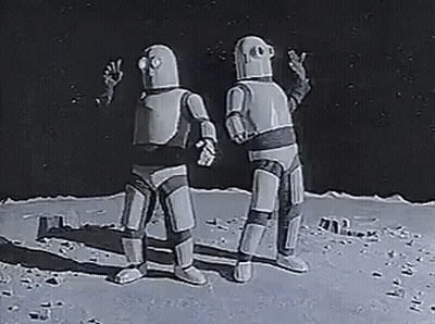 Two Robots Are Standing Next To Each Other On The Moon And Talking To Each Other . GIF