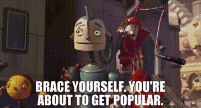 Two Robots Are Standing Next To Each Other With The Words Brace Yourself You 'Re About To Get Popular GIF