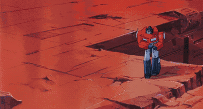 Two Robots Standing On Red Background GIF
