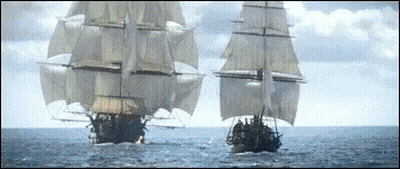 Two Sailboats Sailing In Ocean With Cloudy Sky GIF