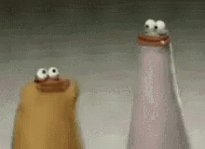 Two Salt And Pepper Shakers With Googly Eyes On Top Of Them GIF