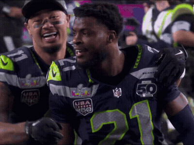 Two Seahawks Players Hugging GIF