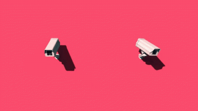 Two Security Cameras Against Pink Background GIF