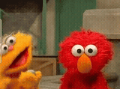 Two Sesame Street Characters Elmo And Oscar Are Standing Next To Each Other . GIF