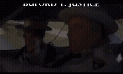 Two Sheriffs In Car, One With Sheriff's Dept Patch GIF
